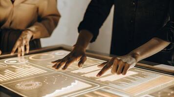 A close view of a holographic business dashboard showcasing key performance indicators in realtime with an employee using intuitive gestures to navigate through the data.. photo