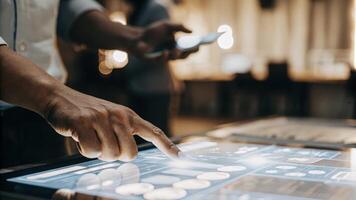A closeup of a hand manipulating a holographic chart with digital controls hovering above the surface representing an intuitive and seamless user experience in data analysis.. photo