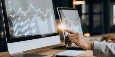 An analyst sits at a sleek workstation interacting with a 3D holographic interface displaying sales projections and KPIs their hand poised to manipulate the visual data.. photo