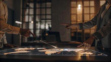 A dynamic view of a holographic world map with interactive geographic data points being manipulated by a team of analysts enhancing their decisionmaking during a strategy meeting.. photo