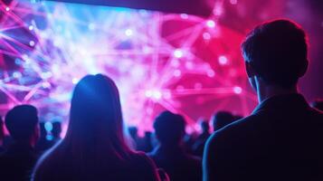 Audience watching interactive presentation with network visualizations on big screen photo