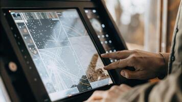 A closeup of a futuristic terminal interface showing detailed investment simulations and 3D models of market scenarios highlighting innovative technology.. photo