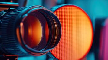 Professional camera lens capturing light with a softbox in background during movie shooting photo