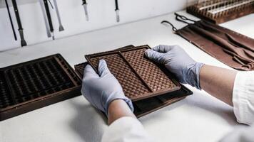 Hands wearing gloves assembling a CRISPR delivery system with nanoparticles emphasizing the careful preparation involved in gene editing workflows.. photo