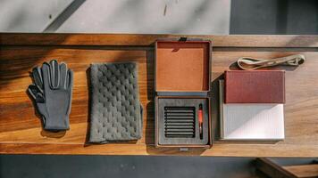 Various genetic testing components are arranged neatly on a wooden surface including a small DNA sequencer gloves and an open manual highlighting the DIY kits complexity.. photo