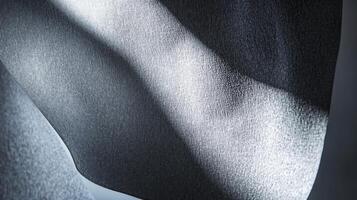 A closeup of the softboxs exterior fabric featuring a sy frame and a textured surface that aids in light diffusion complemented by the soft hues of light spilling onto nearby surfaces photo