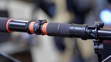 A detailed shot of the boom poles shock mount system revealing multiple layers of foam and elastic bands designed to absorb impacts and vibrations. The mount is securely attached t photo