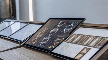 An array of digital interfaces and screens displays realtime data analysis of the holographic DNA with graphs and genetic codes blending seamlessly into the augmented environment.. photo