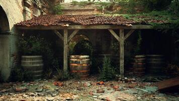 Ruins of an old European mansion with barrels in a dilapidated courtyard video