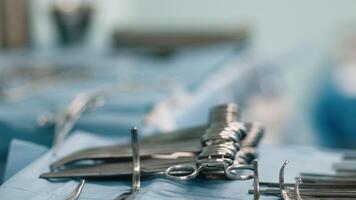 Close-up of medical instruments placed on the operating table in the operating room. High-tech equipment ready for a complex surgical procedure video