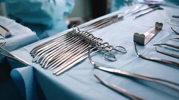 Close-up of medical instruments placed on the operating table in the operating room. Concept high-tech equipment ready for a complex surgical procedure. Perfect for medical projects video