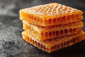 Sweet Honeycomb Stack on Dark Surface for Culinary and Nature Concepts photo