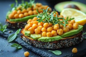 Healthy Vegan Avocado and Chickpea Sandwich with Fresh Arugula Topping photo