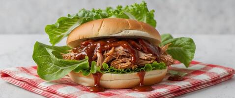 Pulled pork sandwich with bbq sauce on a bun photo