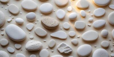 Textured white pebble stone background featuring smooth rounded shapes in varied sizes creating an elegant and serene atmosphere for design projects photo