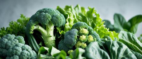 a close up of a variety of green vegetables including broccoli lettuce. photo