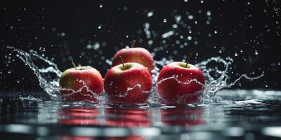 Red Apples Splashing in Water on Black Background. photo