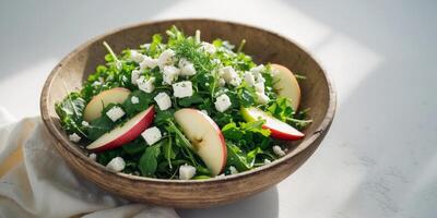 Rocket Salad with Feta Cheese Apples and Fresh Herbs in Rustic Bowl. photo
