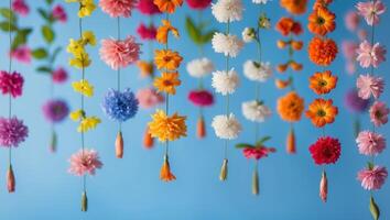 Colorful Floral Garlands for Worship on Blue Background with Empty Space for Text Addition photo