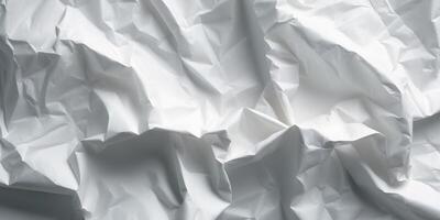 White crumpled paper forming an abstract background with intriguing shapes and shadows photo