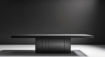 A black background with a black table in the middle. photo