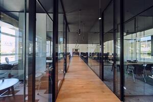 In a setting of modern, glass-walled business startup offices, the open, airy workspace reflects a contemporary and innovative ambiance, promising a dynamic environment for entrepreneurial growth photo