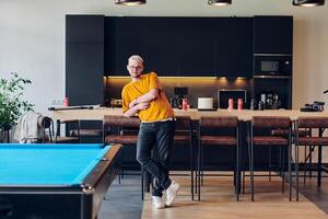A man takes a brief rest from work in a modern startup coworking center, using the moment to recharge and relax with technology by his side. photo