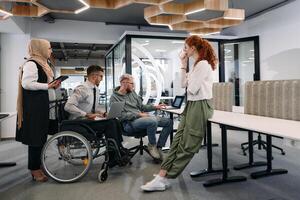 Young group of business people brainstorming together in a startup space, discussing business projects, investments, and solving challenges photo