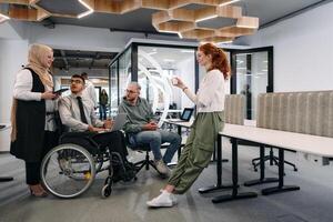 Young group of business people brainstorming together in a startup space, discussing business projects, investments, and solving challenges photo