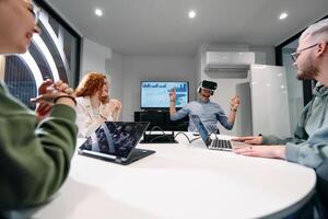 A diverse group of businessmen collaborates and tests a new virtual reality technology, wearing virtual glasses, showcasing innovation and creativity in their futuristic workspace photo