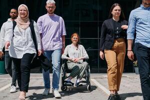 A diverse and confident group of businessmen posing together, with a businesswoman in a wheelchair radiating success, ambition, and unity, capturing the essence of a dynamic and inspiring business photo