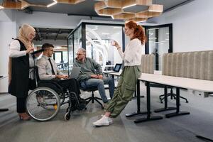 Young group of business people brainstorming together in a startup space, discussing business projects, investments, and solving challenges photo