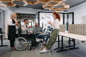 Young group of business people brainstorming together in a startup space, discussing business projects, investments, and solving challenges photo