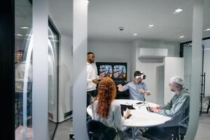 A diverse group of businessmen collaborates and tests a new virtual reality technology, wearing virtual glasses, showcasing innovation and creativity in their futuristic workspace photo