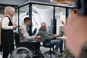 Young group of business people brainstorming together in a startup space, discussing business projects, investments, and solving challenges photo