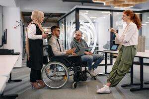 Young group of business people brainstorming together in a startup space, discussing business projects, investments, and solving challenges photo