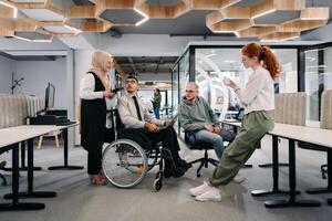 Young group of business people brainstorming together in a startup space, discussing business projects, investments, and solving challenges photo
