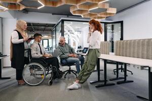 Young group of business people brainstorming together in a startup space, discussing business projects, investments, and solving challenges photo