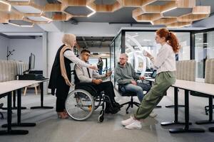 Young group of business people brainstorming together in a startup space, discussing business projects, investments, and solving challenges photo