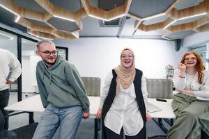 A group of young business professionals stands together, taking a well deserved break from their busy workday, showcasing camaraderie, teamwork, and a moment of relaxation in their dynamic workplace photo