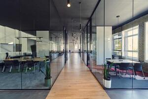 In a setting of modern, glass-walled business startup offices, the open, airy workspace reflects a contemporary and innovative ambiance, promising a dynamic environment for entrepreneurial growth photo
