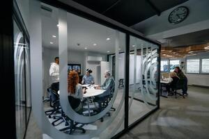 A diverse group of businessmen collaborates and tests a new virtual reality technology, wearing virtual glasses, showcasing innovation and creativity in their futuristic workspace photo