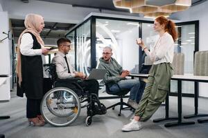 Young group of business people brainstorming together in a startup space, discussing business projects, investments, and solving challenges photo