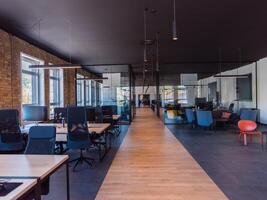 In a setting of modern, glass-walled business startup offices, the open, airy workspace reflects a contemporary and innovative ambiance, promising a dynamic environment for entrepreneurial growth photo