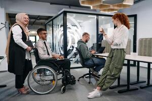 Young group of business people brainstorming together in a startup space, discussing business projects, investments, and solving challenges photo