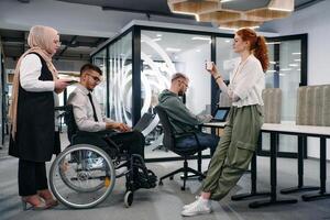 Young group of business people brainstorming together in a startup space, discussing business projects, investments, and solving challenges photo