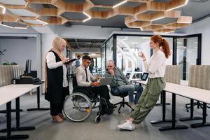 Young group of business people brainstorming together in a startup space, discussing business projects, investments, and solving challenges photo