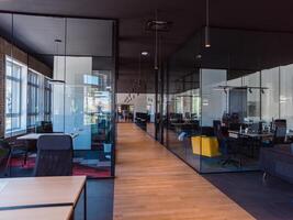 In a setting of modern, glass-walled business startup offices, the open, airy workspace reflects a contemporary and innovative ambiance, promising a dynamic environment for entrepreneurial growth photo