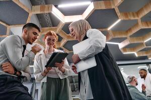 Young group of business people brainstorming together in a startup space, discussing business projects, investments, and solving challenges. photo