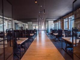 In a setting of modern, glass-walled business startup offices, the open, airy workspace reflects a contemporary and innovative ambiance, promising a dynamic environment for entrepreneurial growth photo